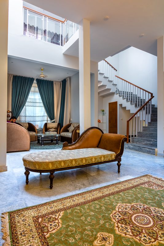 The living room and stair at Khurrum Residence.